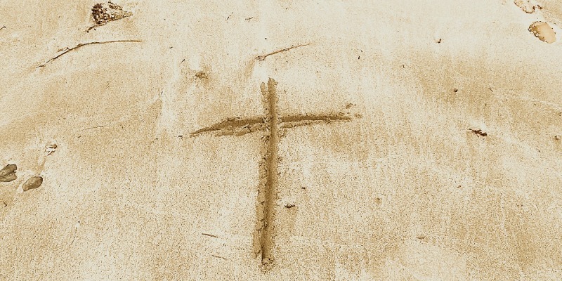 cross in sand